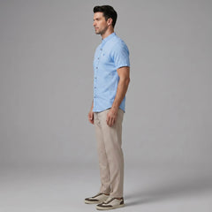 Full length view of man in dark green linen look stand collar shirt and slim tapered trousers