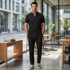 Man wearing dark green linen look stand collar shirt and slim tapered trousers in outdoor lifestyle