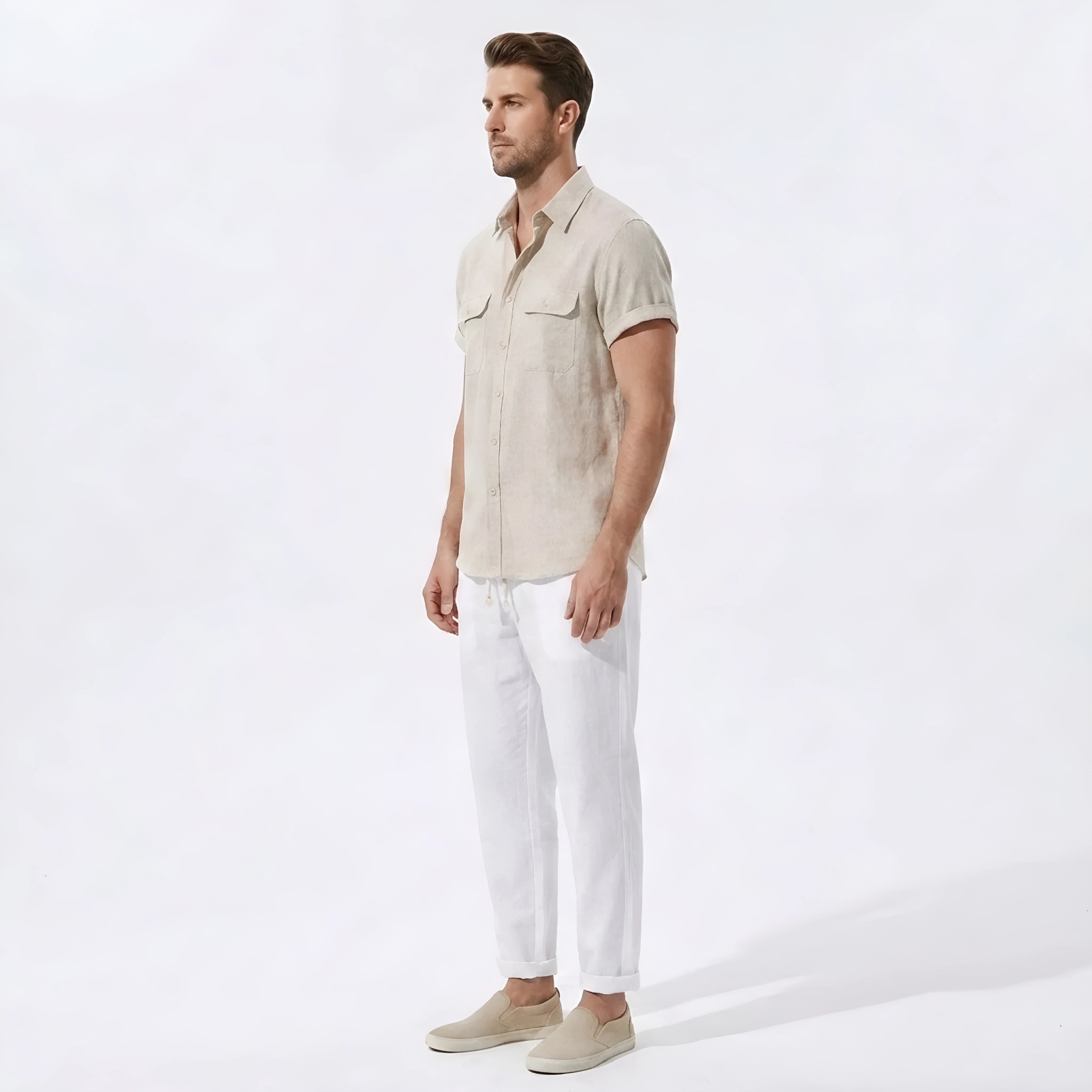 Side view of man in dark green linen rayon blend utility shirt and straight leg linen pants