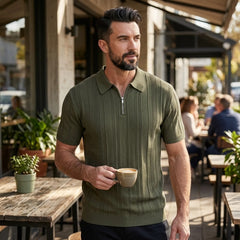 Man wearing dark green stripe jacquard knit zip-up polo shirt in outdoor lifestyle setting
