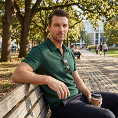 Man in dark green stripe jacquard zip-up polo shirt in sunny outdoor scene