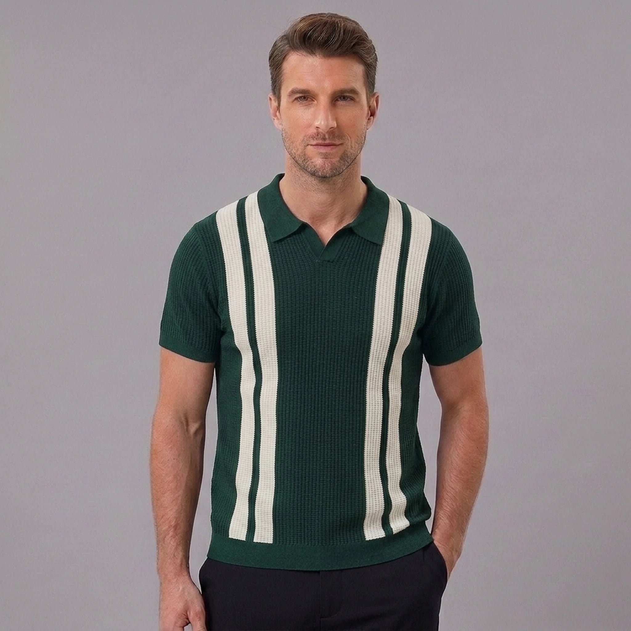 Side view of man in dark green striped knit slim fit polo shirt on plain background