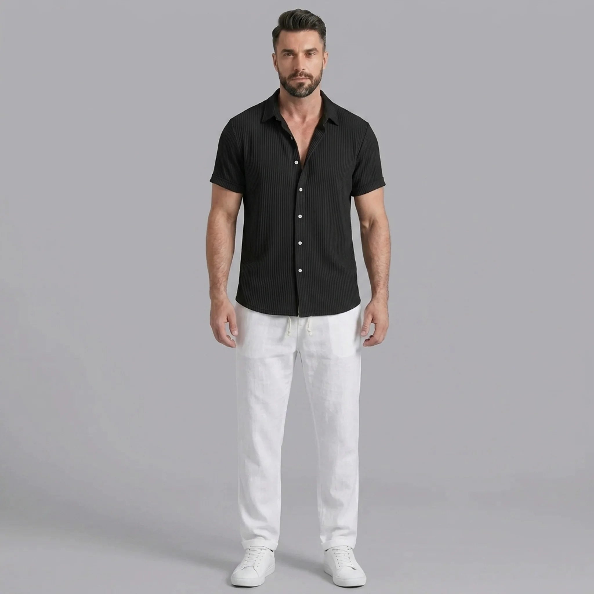 Full length view of man in dark green waffle button up shirt and straight leg linen pants