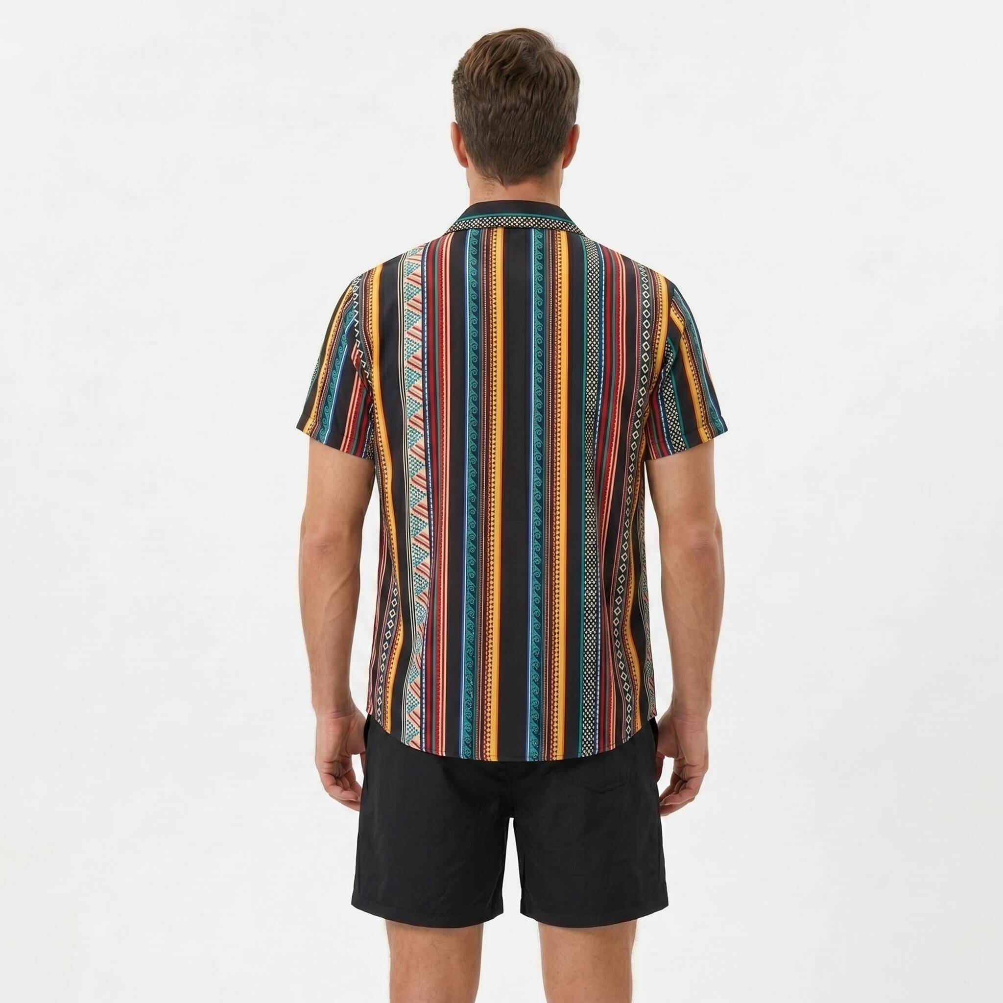 Back view of man wearing colorful ethnic geometric print shirt and swim shorts