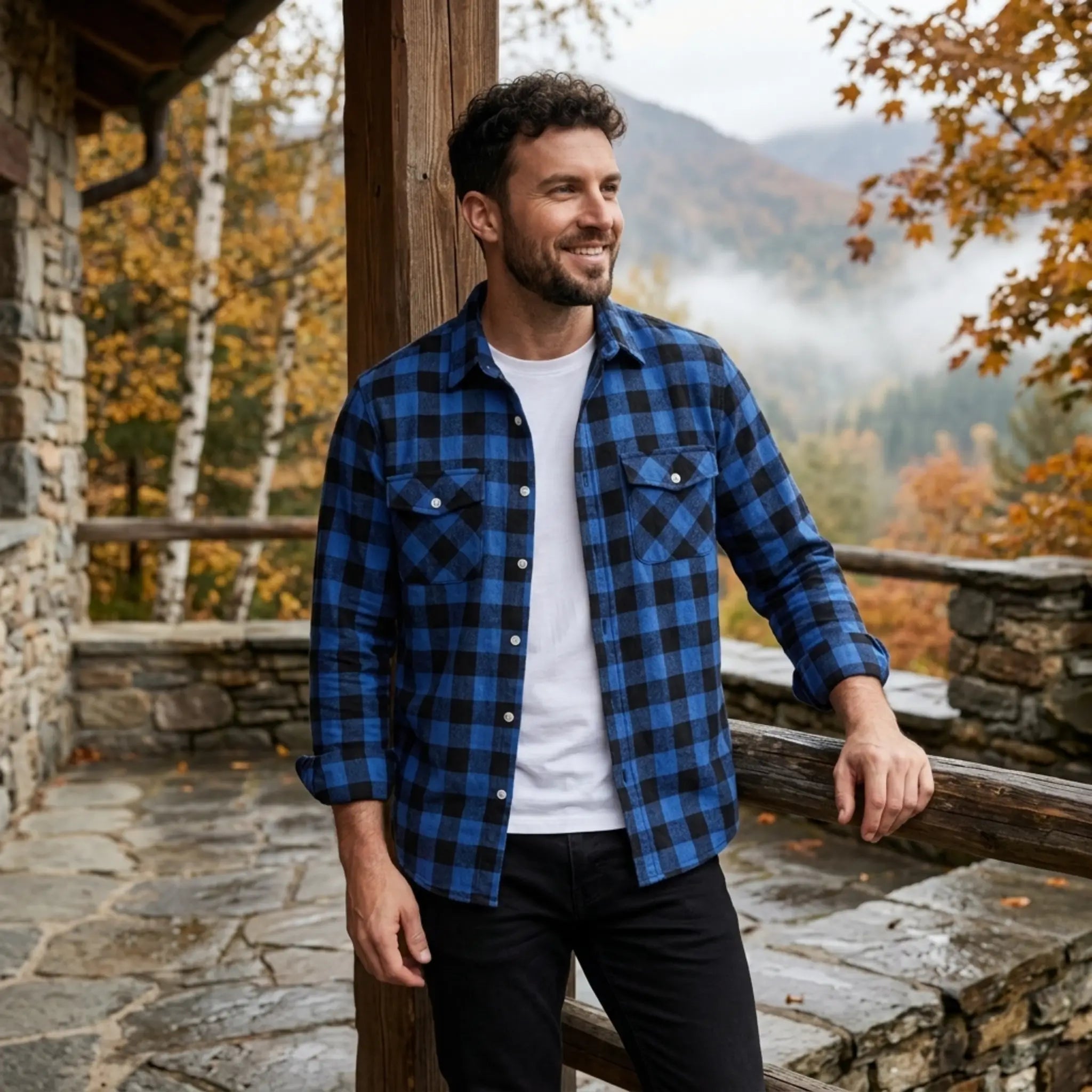 MannerCo blue plaid flannel shirt with turn-down collar worn open over white tee in mountain setting