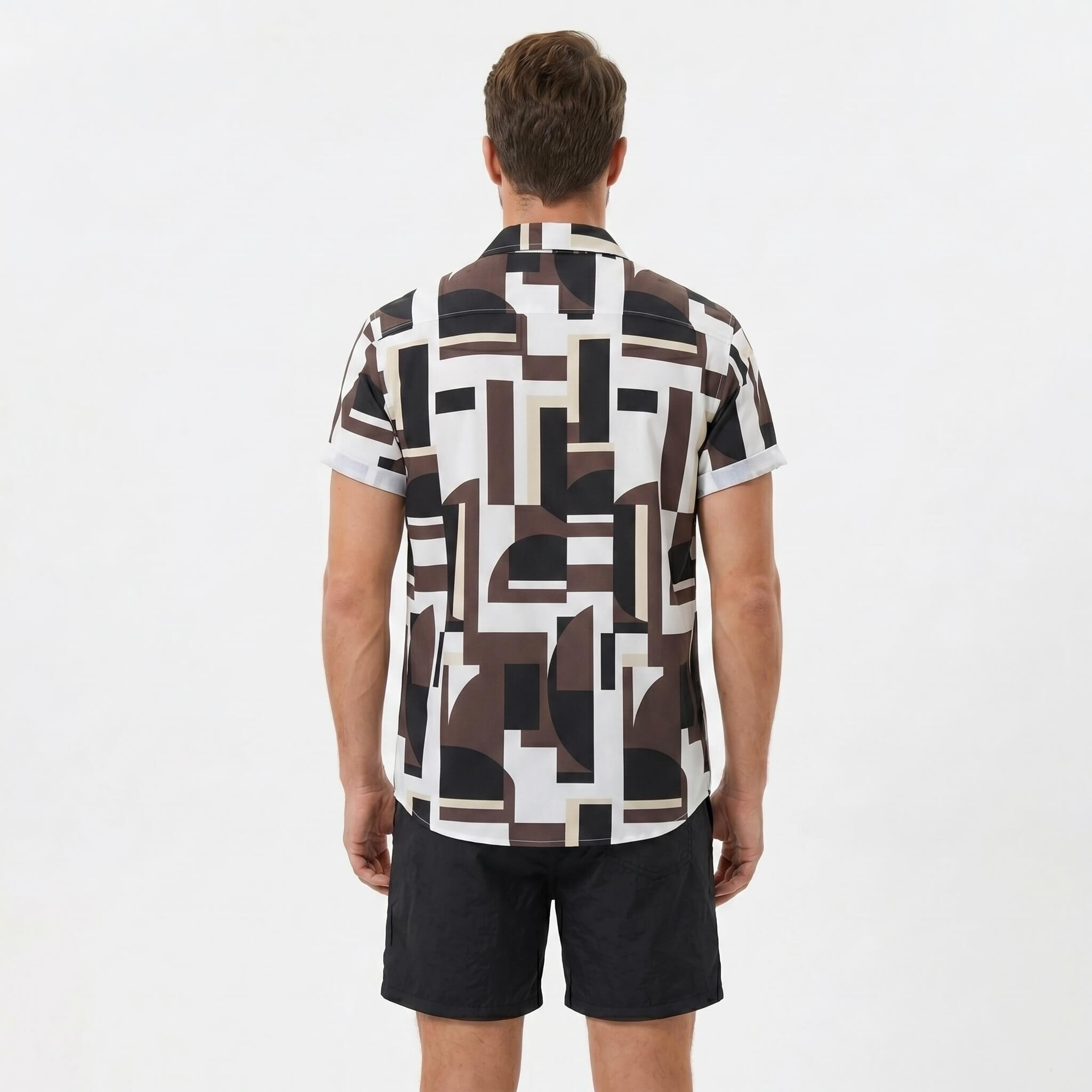 Back view of man wearing geometry colorblock print button up shirt and swim shorts