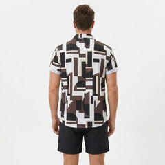 Back view of man wearing geometry colorblock print button up shirt and swim shorts