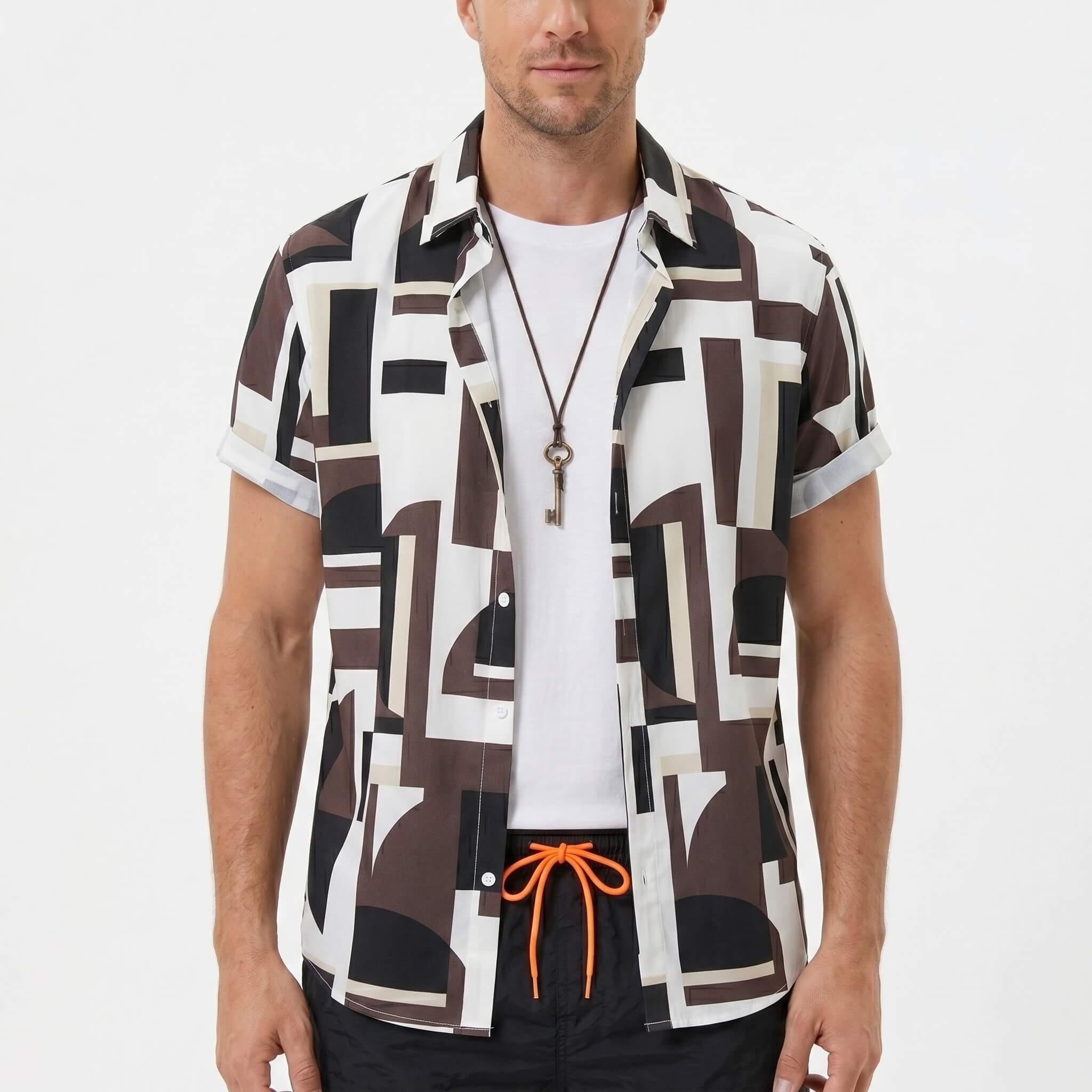 Three quarter view of man in geometry colorblock print shirt and swim shorts on plain background