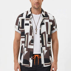 Three quarter view of man in geometry colorblock print shirt and swim shorts on plain background