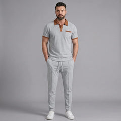 Side view of man in gray color block waffle polo and straight leg pants