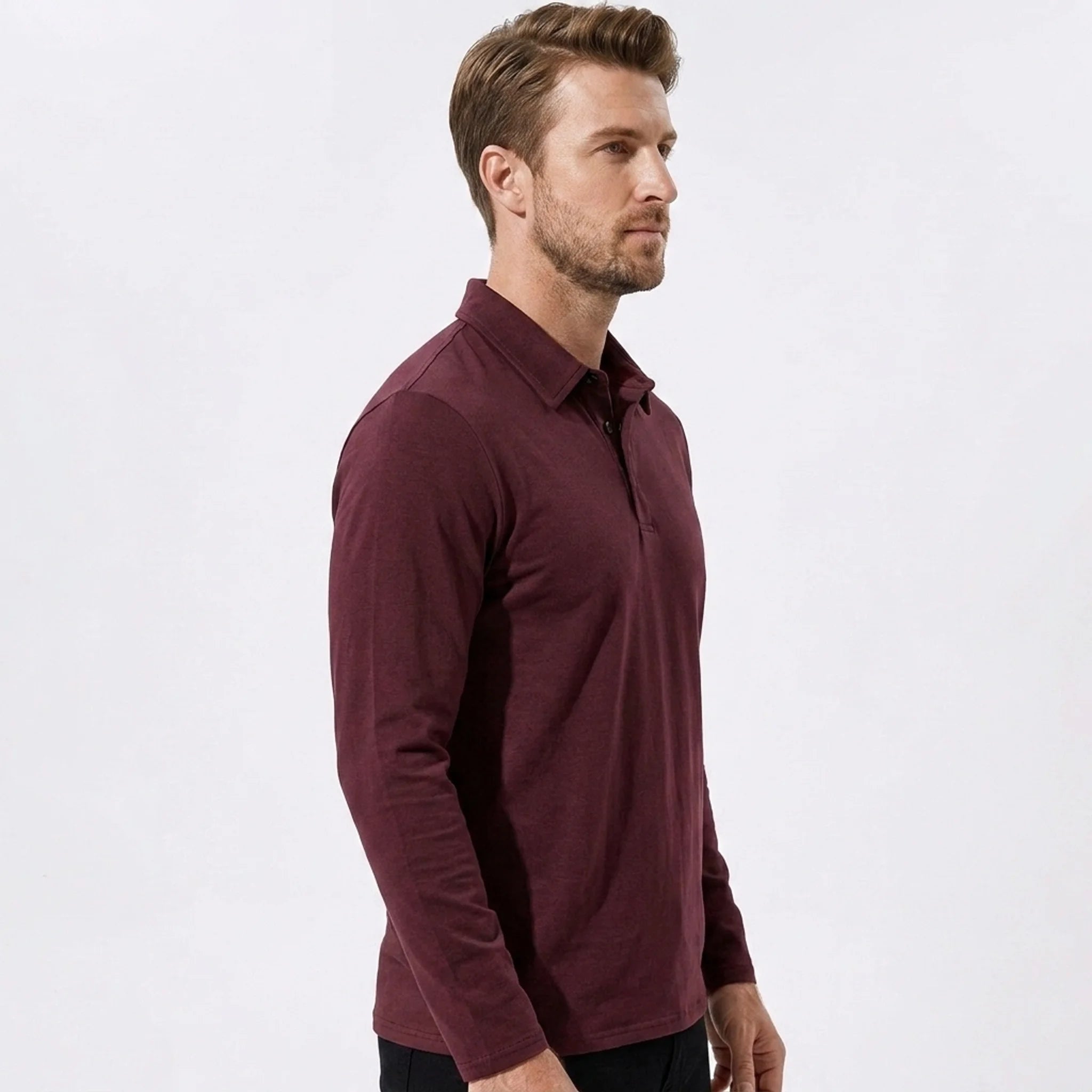 Side view of man in gray solid long sleeve cotton polo shirt