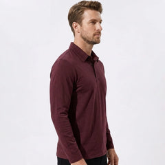 Side view of man in gray solid long sleeve cotton polo shirt
