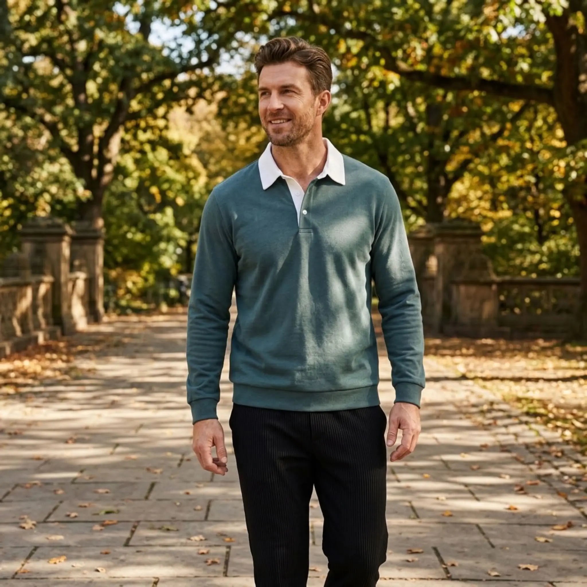 MannerCo green polo collar hoodie loose fit worn outdoors in autumn park setting