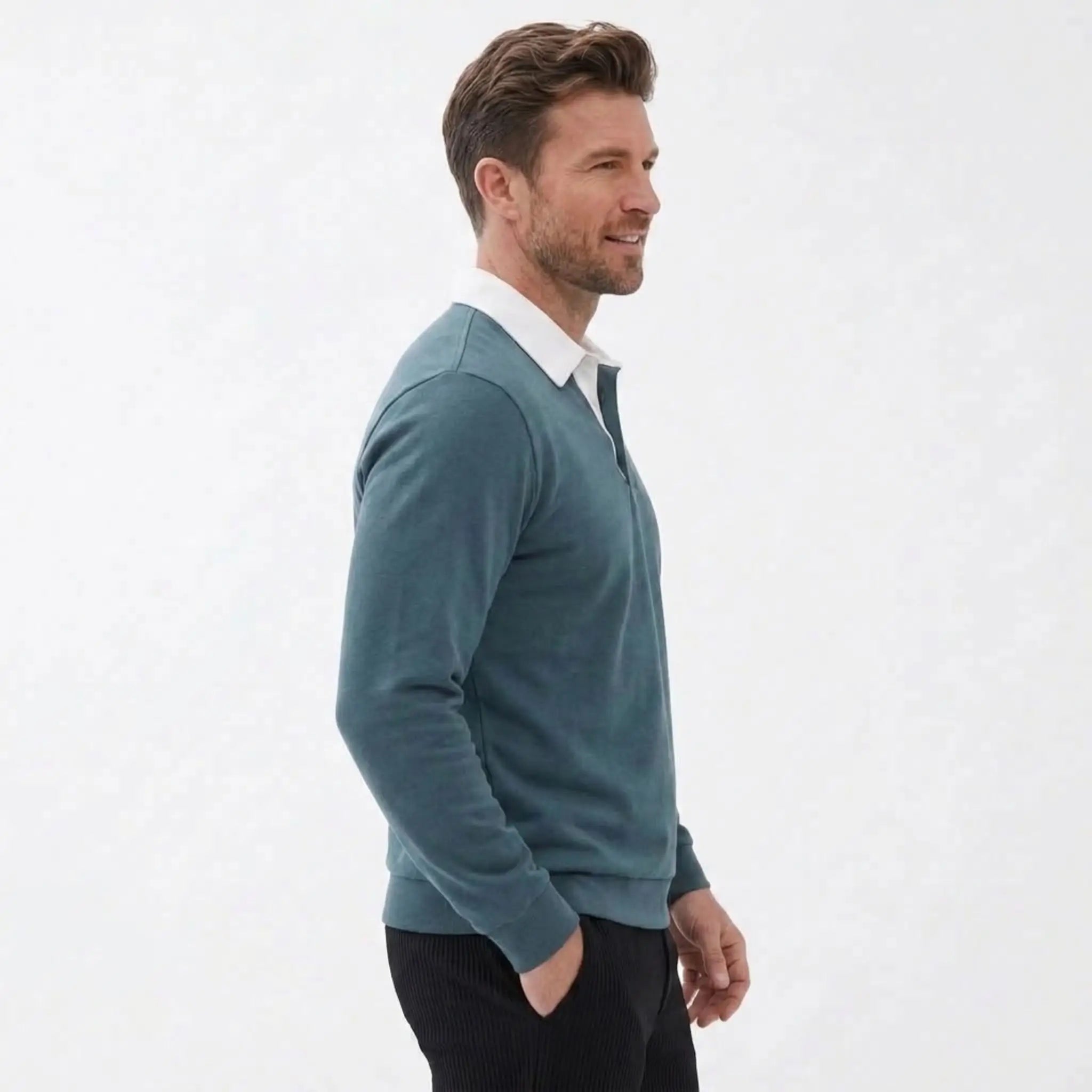 MannerCo green polo collar hoodie side view layered over white shirt with dark pants