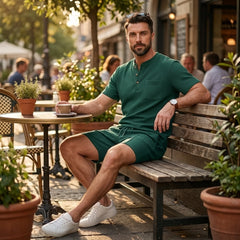 Man in green waffle stand collar shirt and drawstring shorts in sunny outdoor summer scene