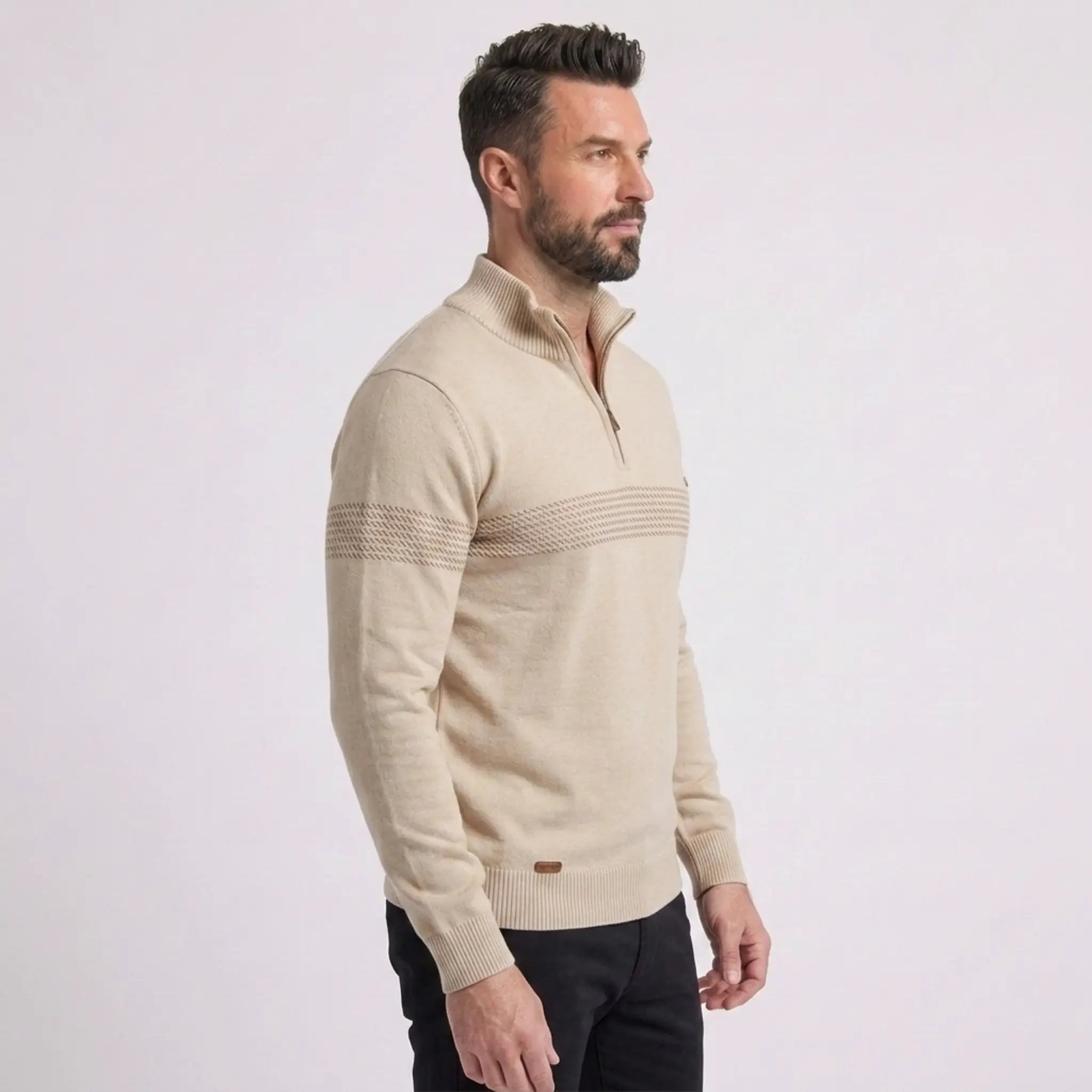 Man wearing MannerCo apricot slim fit half-zip sweater, side view on plain background