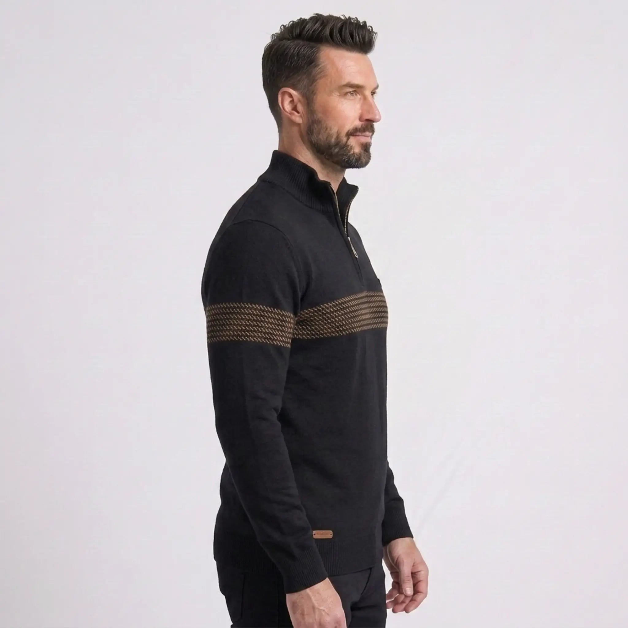 Man wearing MannerCo black slim fit half-zip sweater with stripe detail, side view