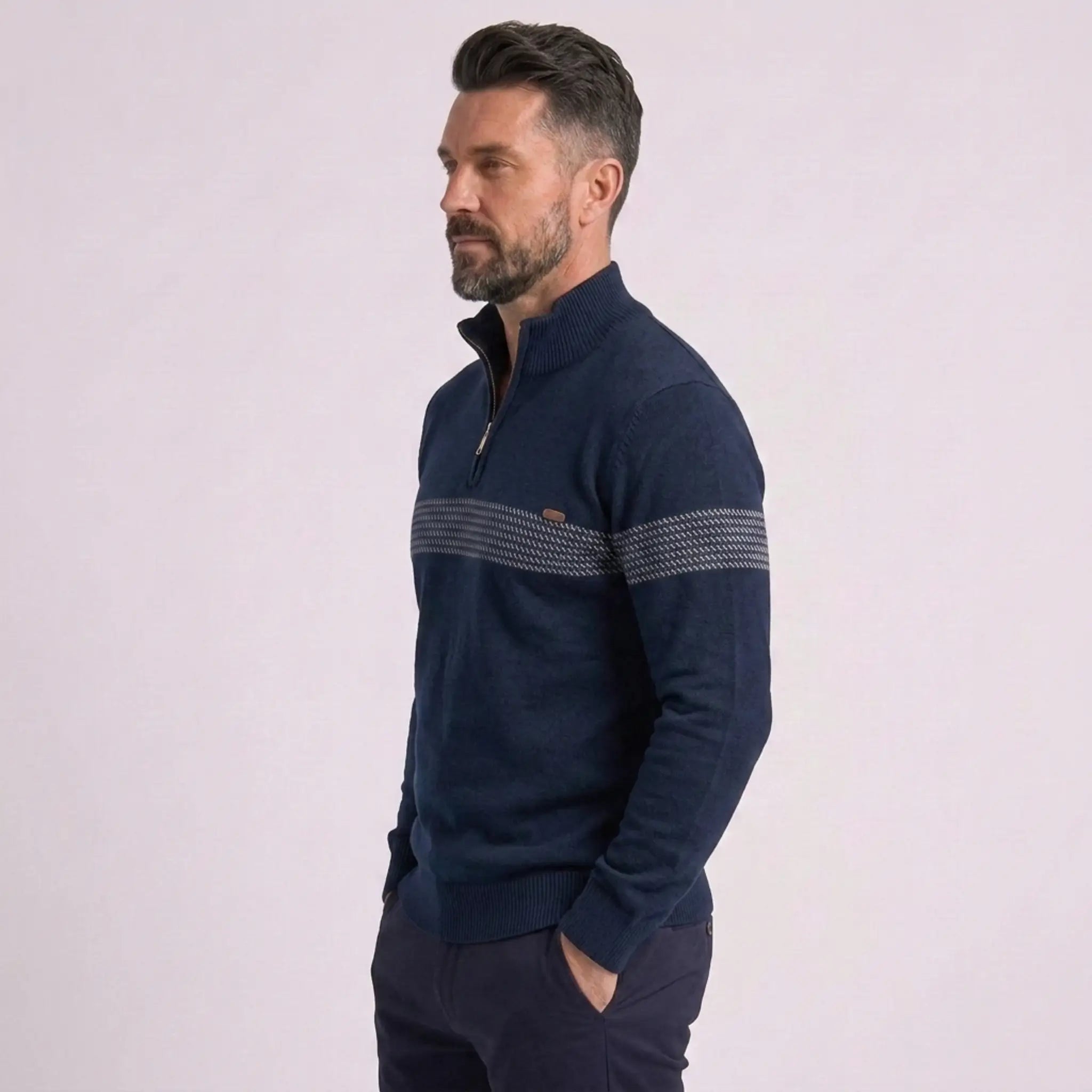 Man wearing MannerCo navy half-zip sweater slim fit, side view on plain background