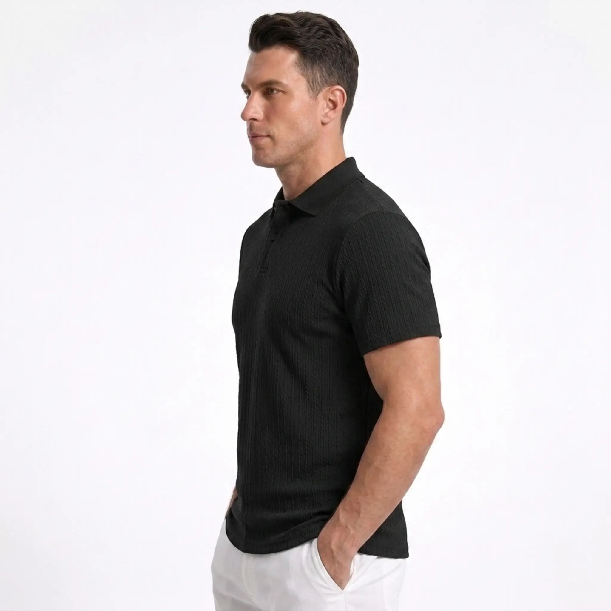 Man wearing MannerCo black jacquard knit polo shirt in outdoor lifestyle setting