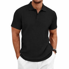 MannerCo black jacquard knit polo shirt with subtle woven texture and classic collar, front view display