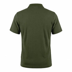 Man wearing MannerCo khaki jacquard knit polo shirt in outdoor lifestyle setting