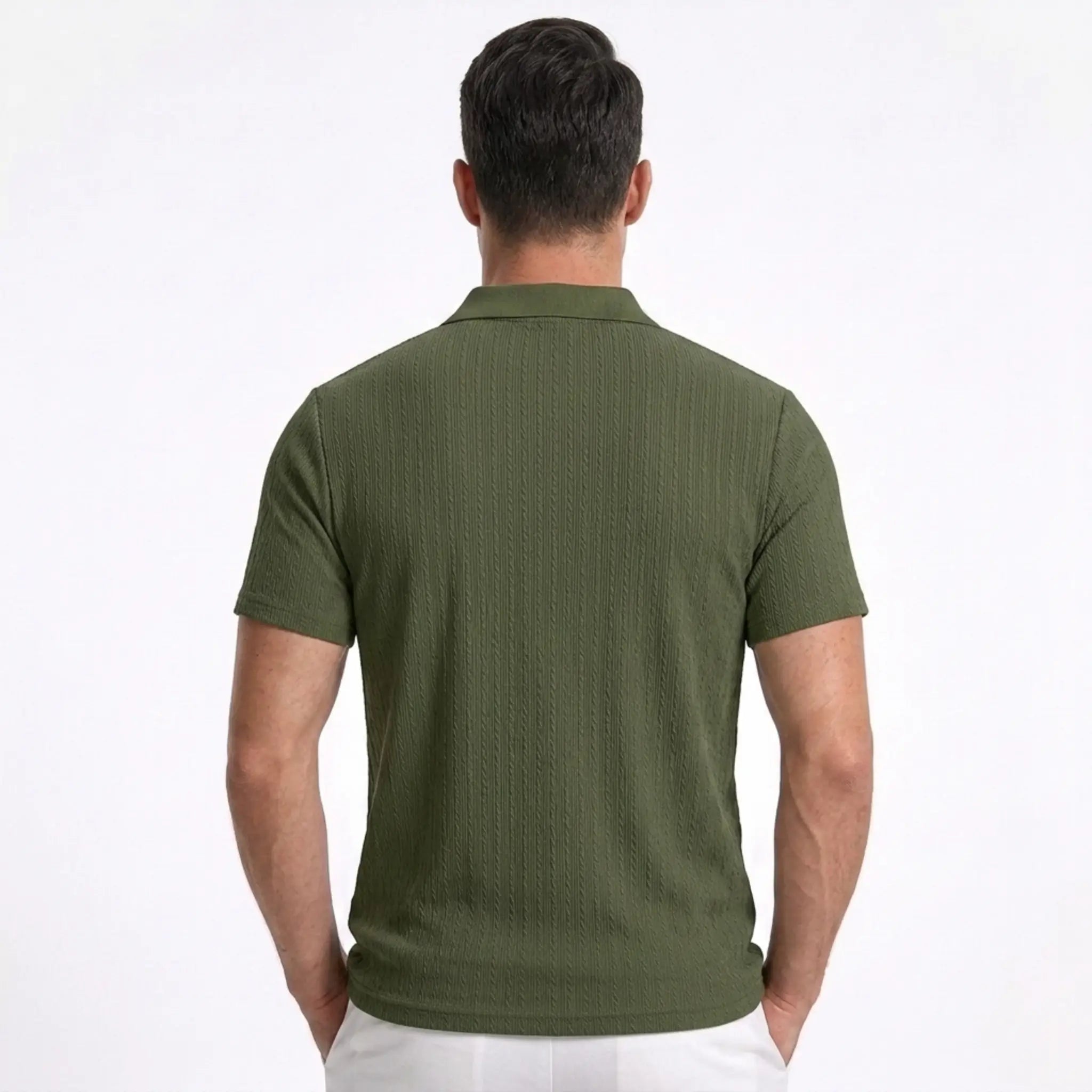Man wearing MannerCo khaki jacquard knit polo shirt in outdoor lifestyle setting