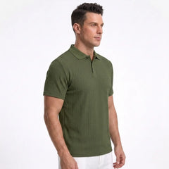 Man wearing MannerCo khaki jacquard knit polo shirt in outdoor lifestyle setting