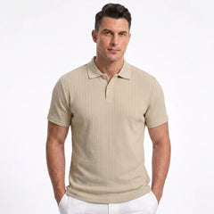 Man wearing MannerCo light gray jacquard knit polo shirt with button placket and classic collar, front view