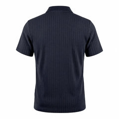 MannerCo navy blue jacquard knit polo shirt with subtle texture pattern, front view product display