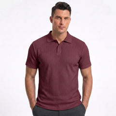 Man wearing MannerCo wine red jacquard knit polo shirt in outdoor lifestyle setting