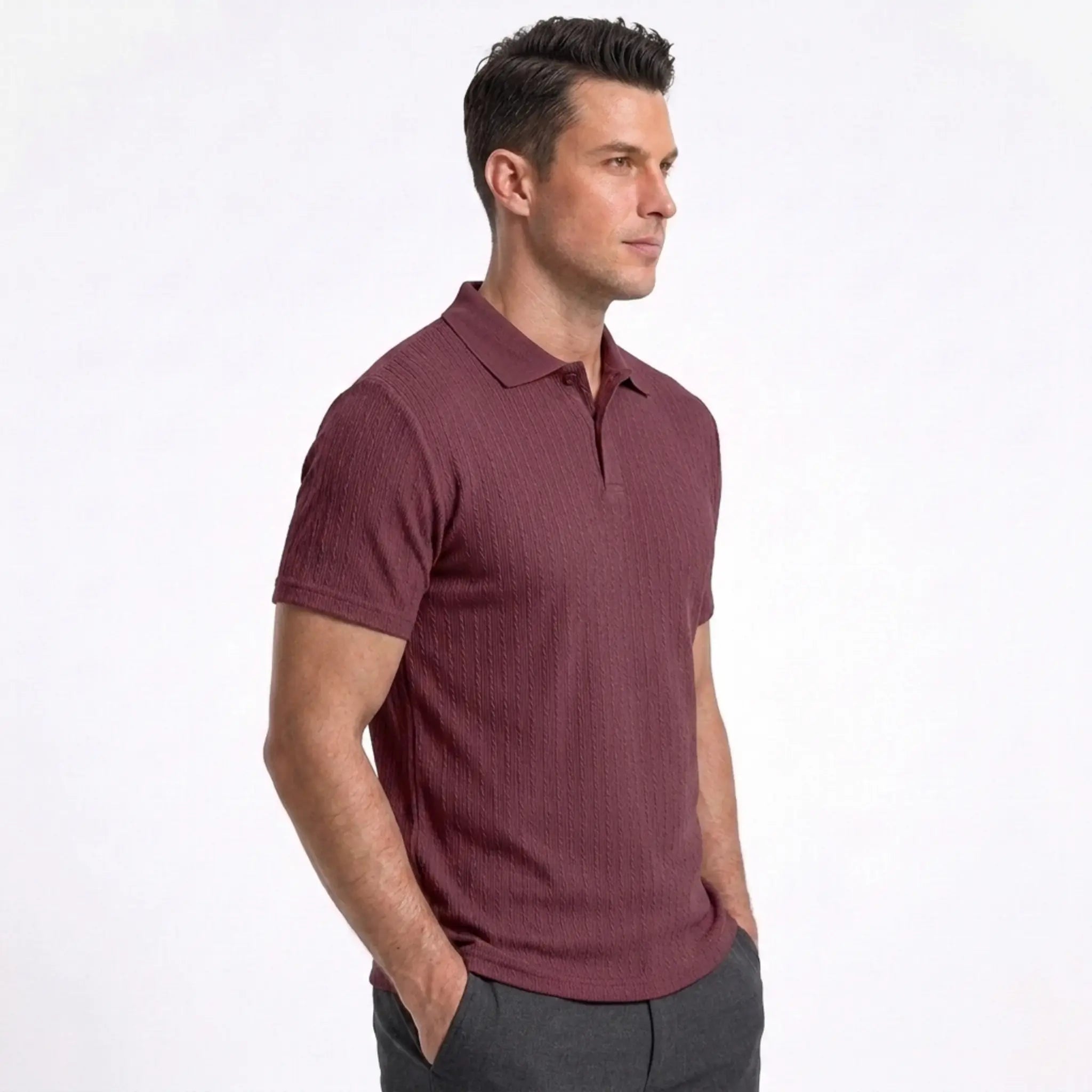 Man wearing MannerCo wine red jacquard knit polo shirt in outdoor lifestyle setting