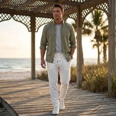 Man wearing MannerCo white jacquard ribbed straight leg drawstring trousers in outdoor lifestyle setting