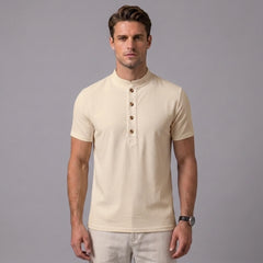 Man wearing a khaki linen jacquard short sleeve polo shirt front view on plain background