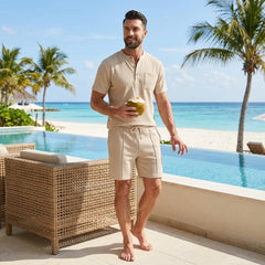 Man in khaki waffle stand collar shirt and drawstring shorts in sunny outdoor summer scene