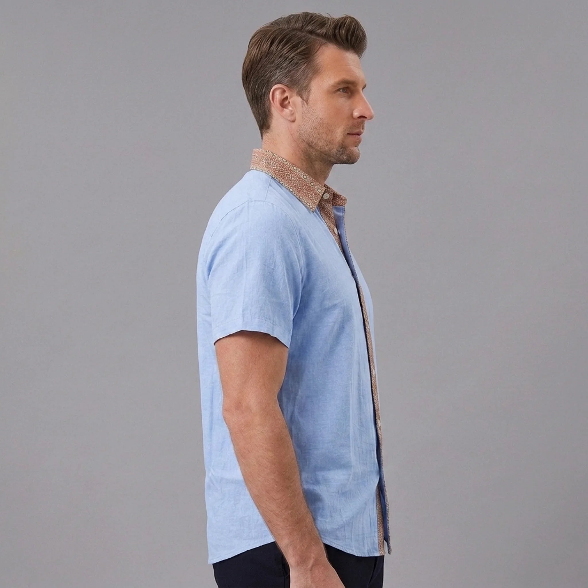 MannerCo light blue linen blend short sleeve shirt with contrast collar, side view on male model