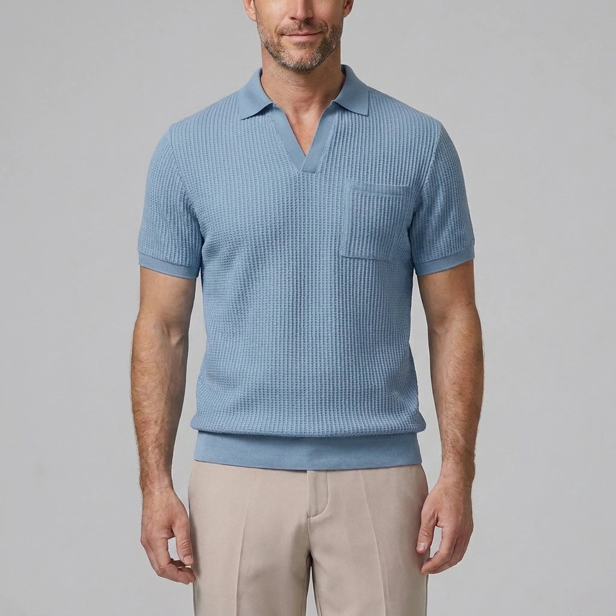 Back view of man wearing light blue waffle johnny collar polo and slim fit tapered pants