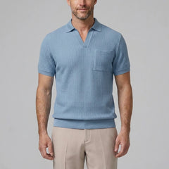 Back view of man wearing light blue waffle johnny collar polo and slim fit tapered pants