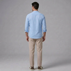 MannerCo light blue linen stand collar shirt with slim tapered beige trousers back view