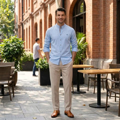 MannerCo light blue linen stand collar shirt and slim tapered trousers set worn outdoors