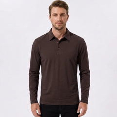 Man wearing maroon solid long sleeve cotton polo shirt in outdoor lifestyle setting