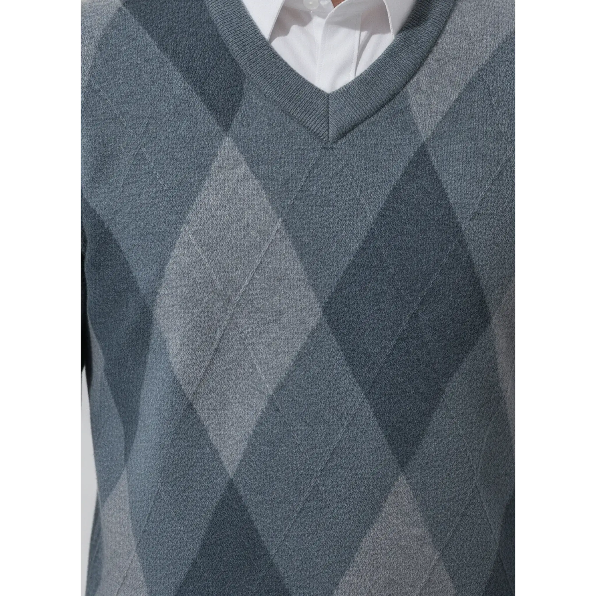 Blue argyle sweater close-up of the argyle knit pattern