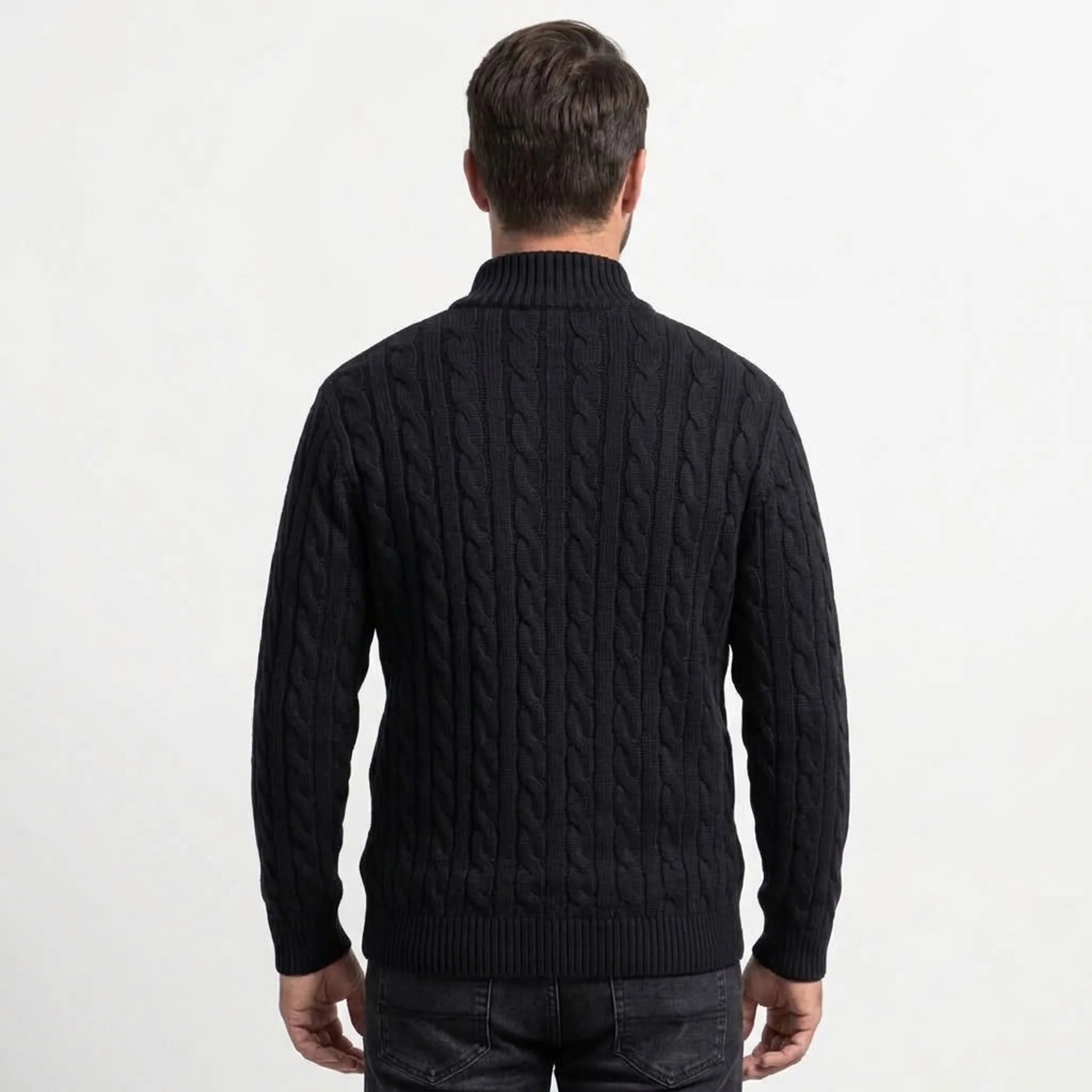 Black cable knit quarter-zip sweater on model, back view