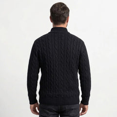 Black cable knit quarter-zip sweater on model, back view