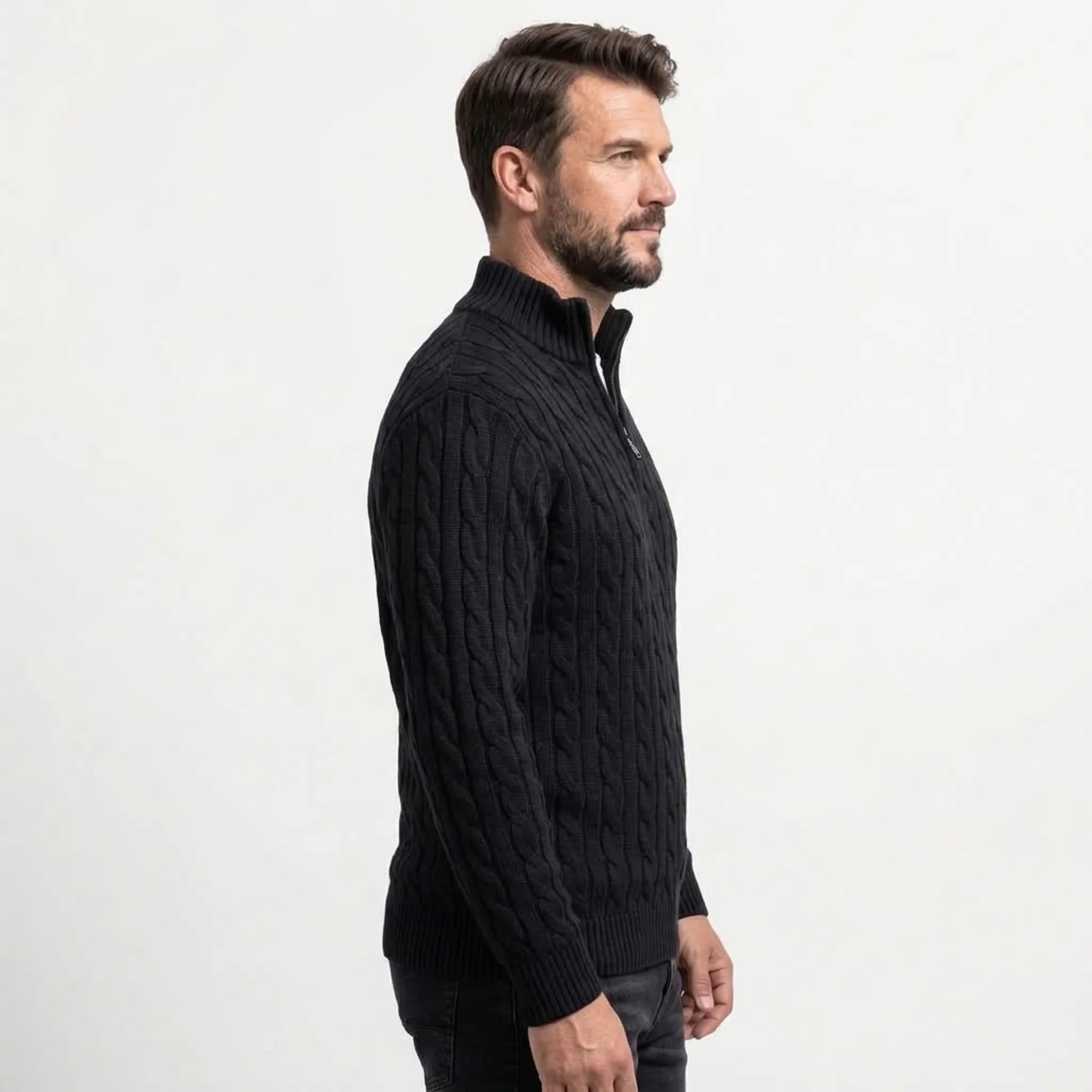 Black cable knit quarter-zip sweater on model, side view
