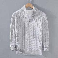 Light grey cable knit quarter-zip sweater, front view on hanger