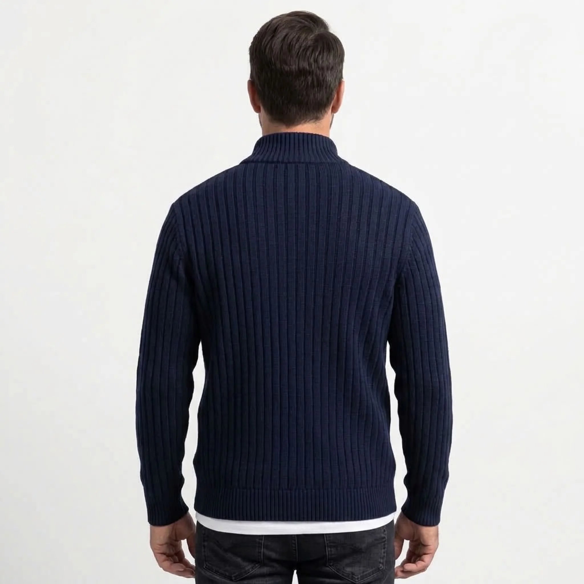 Navy cable knit zip sweater on model, back view