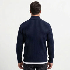 Navy cable knit zip sweater on model, back view