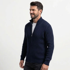 Navy cable knit zip sweater on model, side view