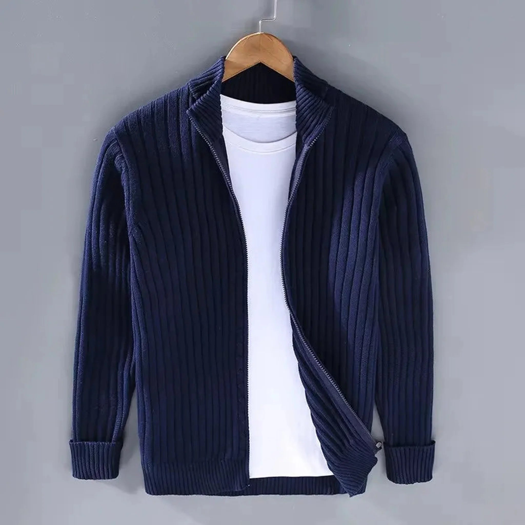 Navy cable knit full-zip sweater, front view on hanger