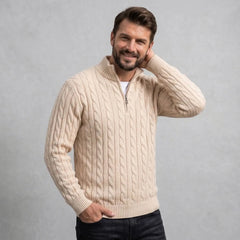 Sand cable knit quarter-zip sweater on model, adjusting the mock neck